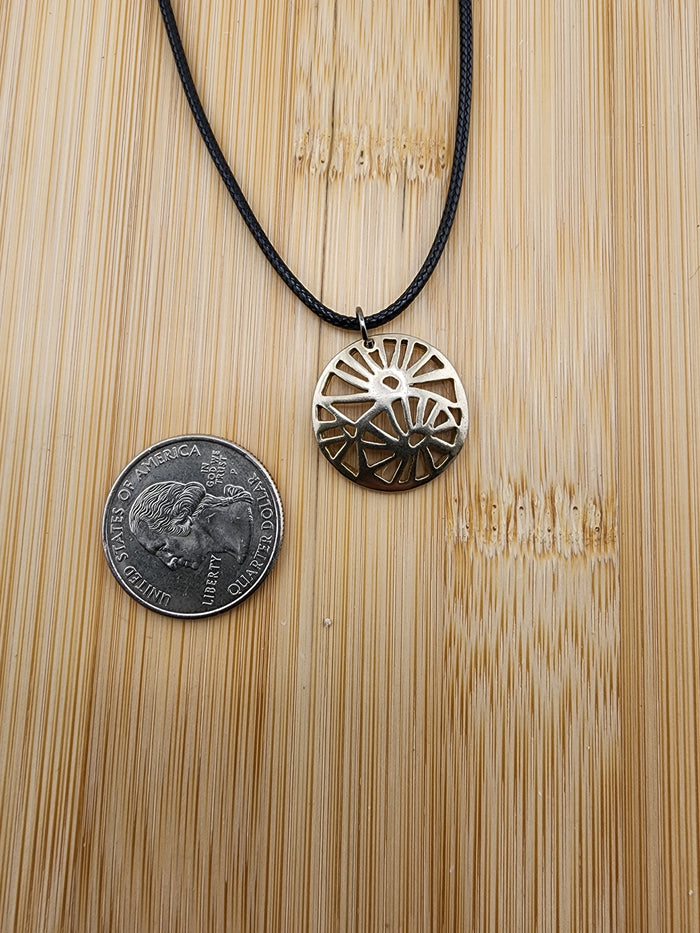 18in Adjustable Gold Tone Sunburst Pendant Necklace on Black Cord -