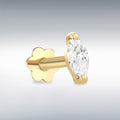 Gold labret stud earring with a clear gemstone on a gray background