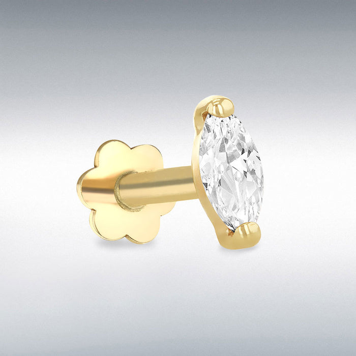 Gold labret stud earring with a clear gemstone on a gray background