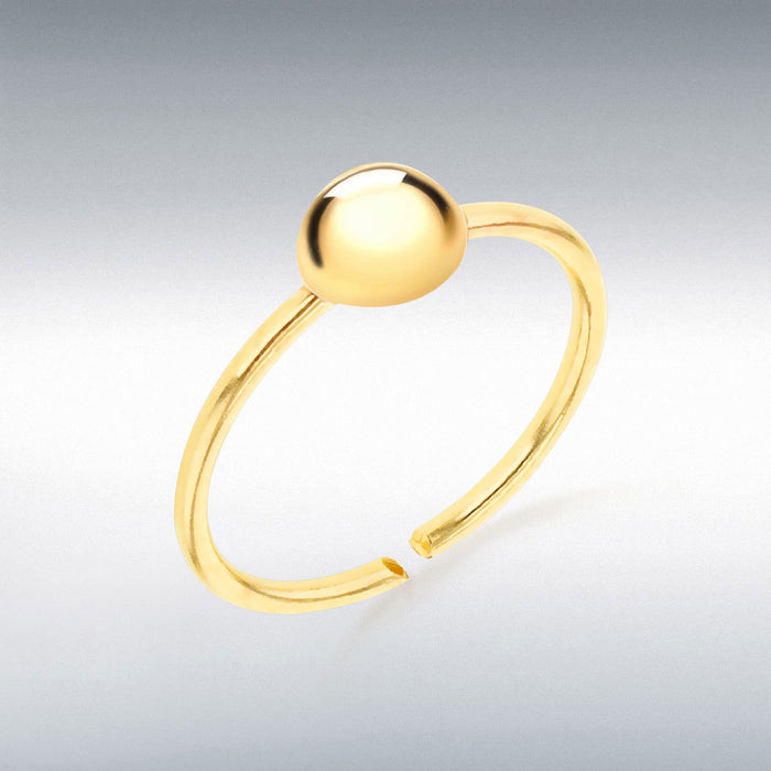 Gold labret stud with a round gold ball on a gray background