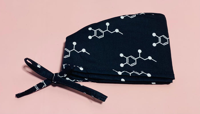 Code Cart Cap - Black Scrub Hat with White Adrenaline Design on a light pink background