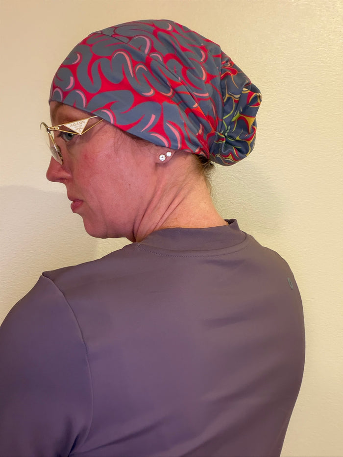 Dr. Betsy Grunch (aka Ladyspinedoc) wearing the pink Neurofeedback Junk Brands Scrub Cap