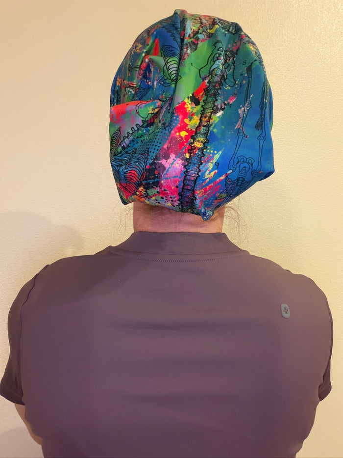 Dr. Betsy Grunch (aka Ladyspinedoc) wearing the green Anatomical Junk Brands Scrub Cap