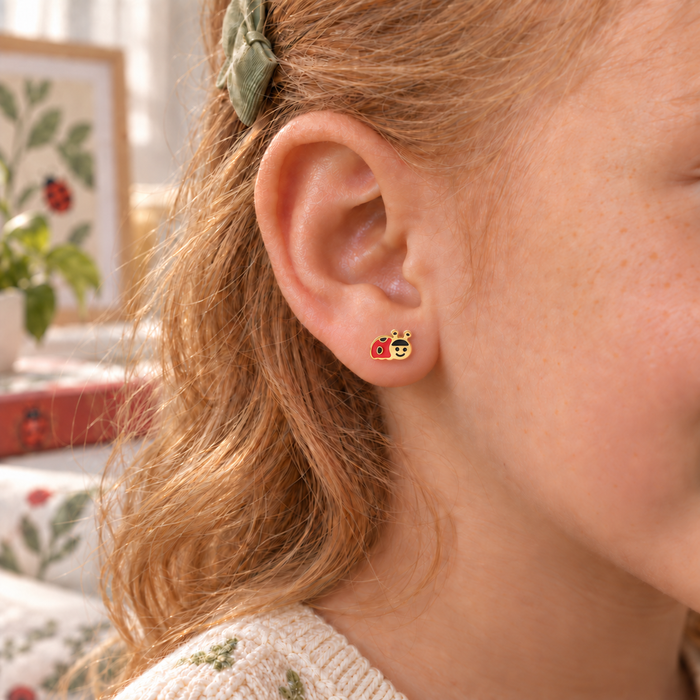 Ladybird hypoallergenic earring worn in a child’s ear, designed for sensitive ears