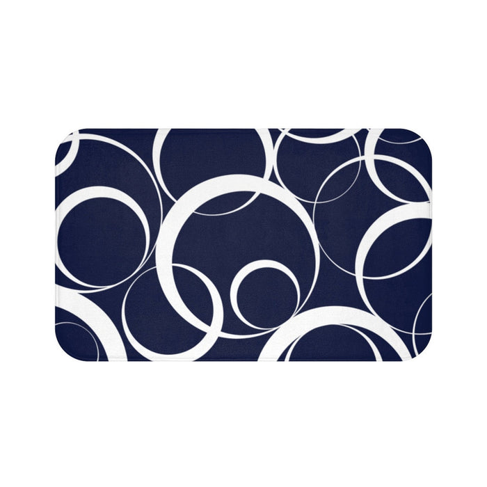 floor mat with white rings against a navy blue background.
