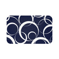 floor mat with white rings against a navy blue background.