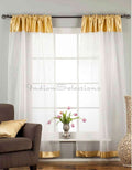 White sheer tissue rod pocket curtains hung at a window